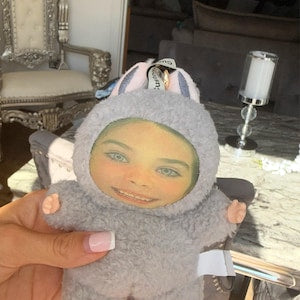 Gray face plush keychain in Chanel’s Etsy photo review